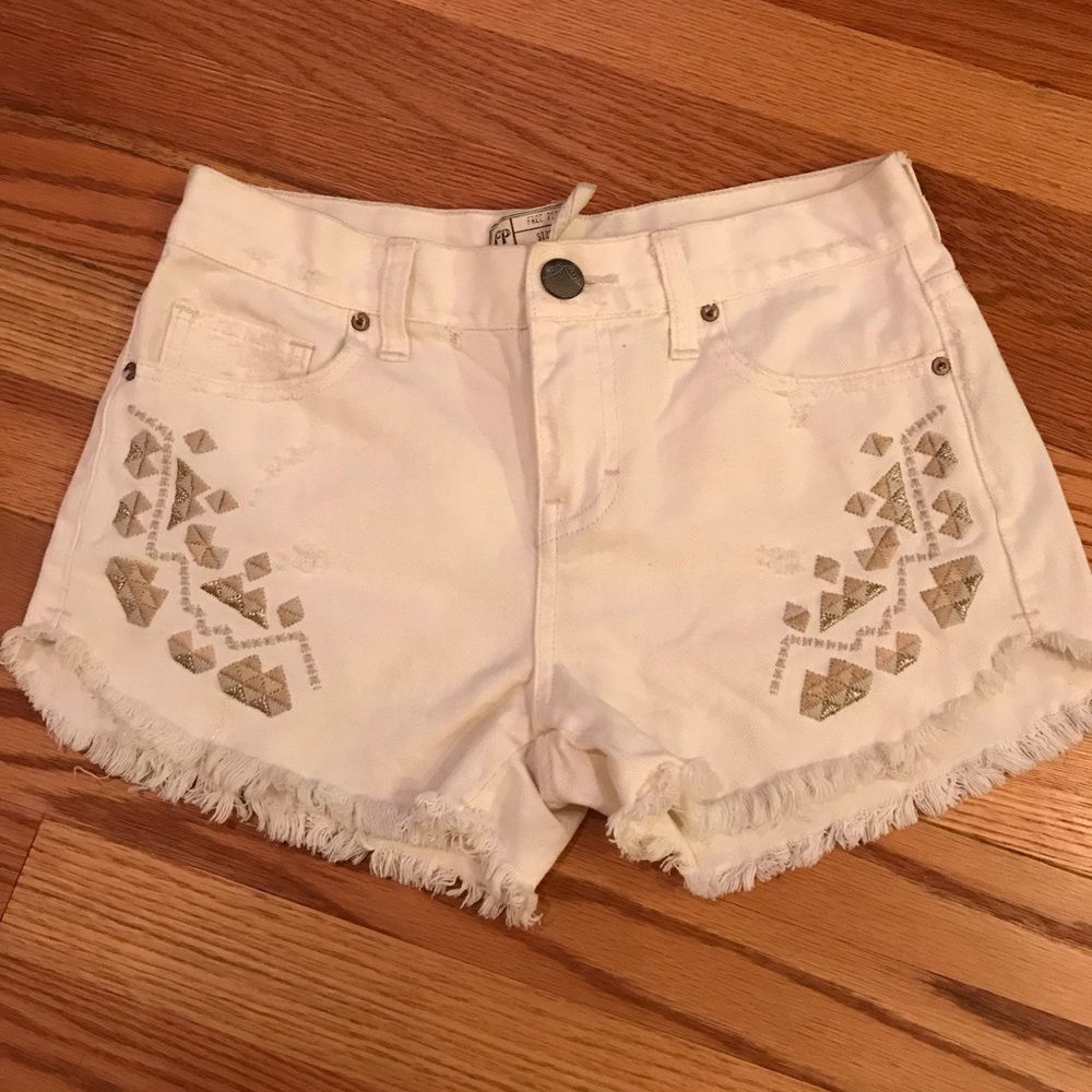 Free people embroidered white denim cutoffs